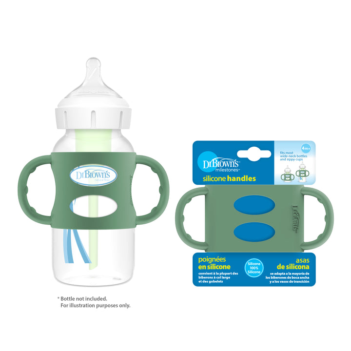 Image of a Dr. Brown's baby bottle equipped with green no-slip easy-grip silicone handles, designed to foster independent drinking skills. Beside it is the packaging for Dr. Brown’s® Milestones™ Wide-Neck Silicone Handles, labeled in both English and Spanish. The bottle includes a white cap and nipple.