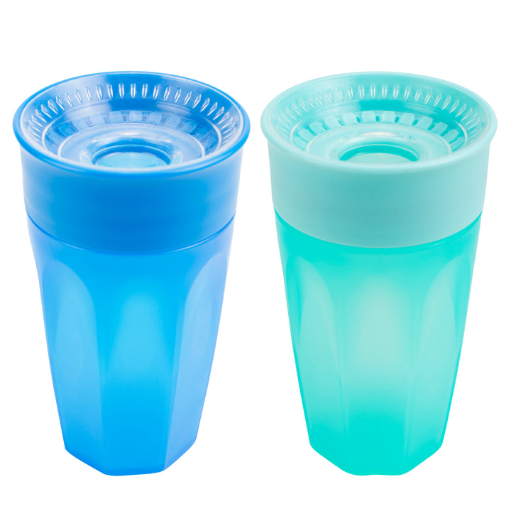 Two Dr. Brown’s® Milestones™ Cheers360™ Cups are displayed side by side. The left cup is dark blue with a clear blue lid, while the right cup is light turquoise with a matching lid. Both lids feature a raised circular design in the center, similar to those found on 360-degree sippy cups for easy grip, and each holds 10 oz/300 mL of liquid.