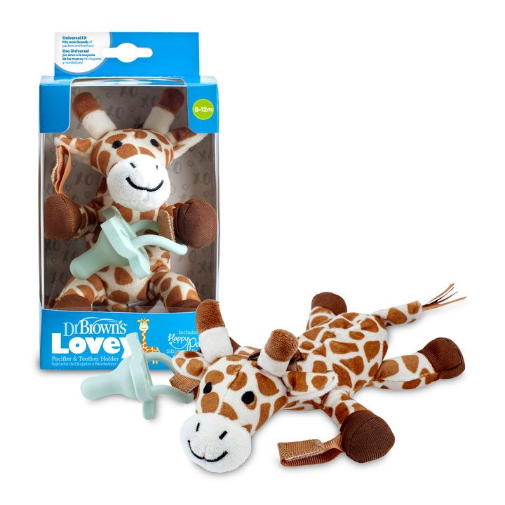 A plush giraffe toy, known as Dr. Brown’s® Lovey Pacifier and Teether Holder, is displayed outside its packaging. The packaging highlights the product along with the text "Dr. Brown's Lovey Pacifier & Teether Holder." The giraffe features a brown-and-white design with a smiling face, bringing comfort and joy to little ones.