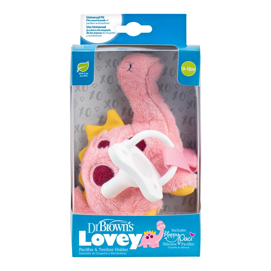 The image showcases a Dr. Brown's Lovey Pacifier and Teether Holder set in dinosaur design packaging. The pink plush flamingo toy includes a white silicone pacifier, designed for ages 0-12 months with universal fit packaging.