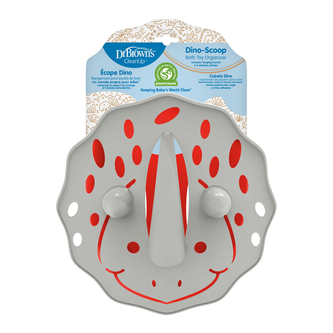 A gray Baby Bath Toy Organizer featuring a triceratops theme with red accents is displayed in its packaging. Known as the Dr. Brown’s™ CleanUp™ Dino-Scoop, this delightful organizer holds bath toys securely and has suction cups for easy attachment.