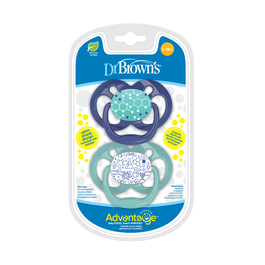 The package includes two Dr. Brown's™ Advantage™ pacifiers, designed with a reversible bulb. The first pacifier features a teal color with circle patterns, and the second is light blue showcasing a geometric design, ideal for babies aged 6-18 months.