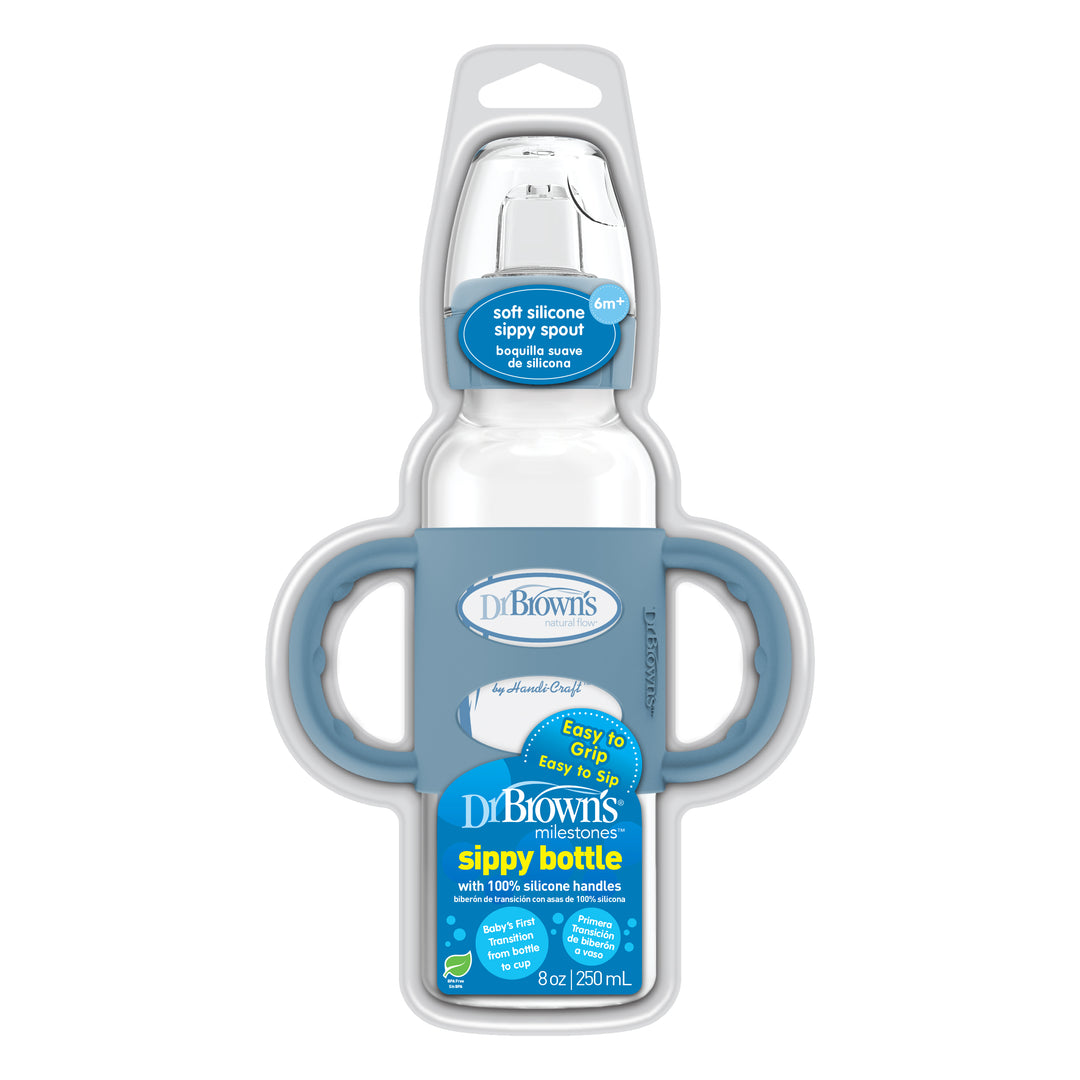 The Dr. Brown’s® Milestones™ Narrow Sippy Spout Bottle is equipped with a soft spout, an 8 oz/250 mL capacity, and gray silicone handles. It is expertly designed to facilitate a smooth transition from bottle to cup, with packaging that emphasizes its comfortable grip and spill-resistant features.