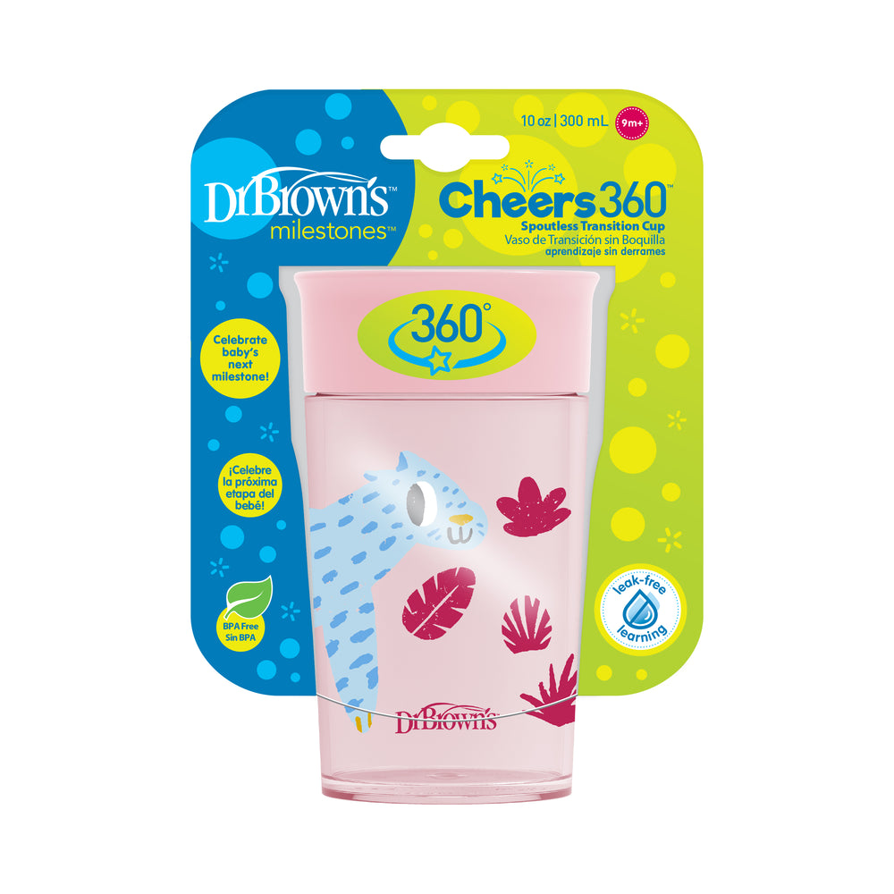 A pink Dr. Brown’s® Milestones™ Cheers360™ Cup with a capacity of 300 ml is designed for toddlers perfecting their drinking skills. It includes a silicone valve to ensure it's leak-proof and features an adorable animal and leaf motif. Packaged in blue and green, the box highlights that it is BPA-free.