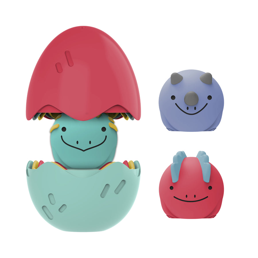 Introducing Dr. Brown’s™ CleanUp™ Float & Hatch Dino Eggs, a set of vibrant dinosaur toys designed for visual stimulation during play. The largest toy is a charming nesting dino friend in green and red, resembling an egg hatching. Among the set, the purple dinosaur features small horns while the red one is adorned with blue spikes. Each toy has simple black eyes and cheerful smiles, making them delightful companions for any playtime adventure.