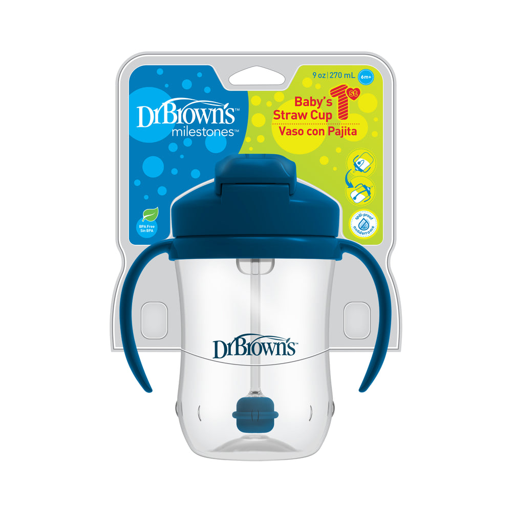 The Dr. Brown’s™ Milestones™ Baby’s First Straw Cup, crafted for an effortless bottle-to-cup transition, comes with a blue lid and handles. It is equipped with a weighted straw and packaged in a clear container labeled "Baby’s First Straw Cup" and "Vaso con Pajita," offering a capacity of 9 oz (270 ml).