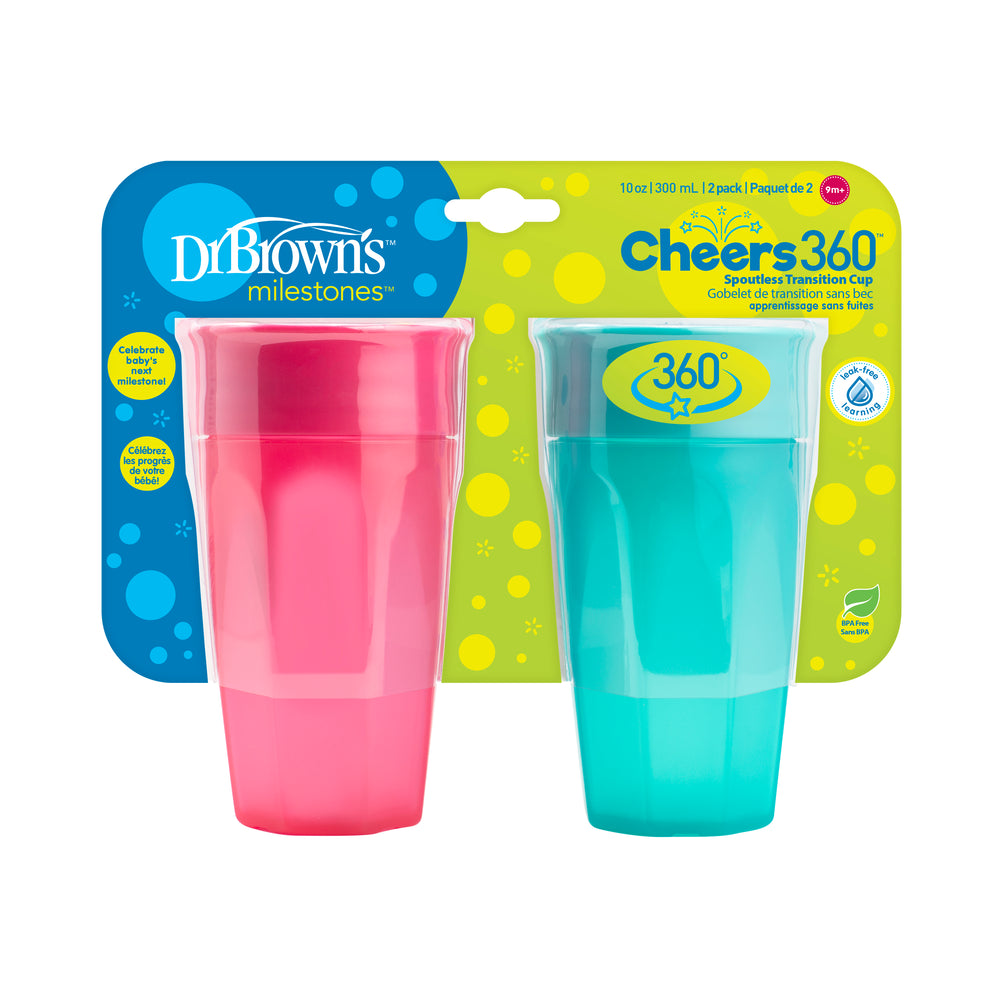 Two Dr. Brown's® Milestones™ Cheers360™ Cups in pink and blue are featured in their packaging. The label emphasizes the innovative "sip and see" silicone valve with a spill-proof, spoutless design, and each sippy cup holds 10 oz (300 mL).