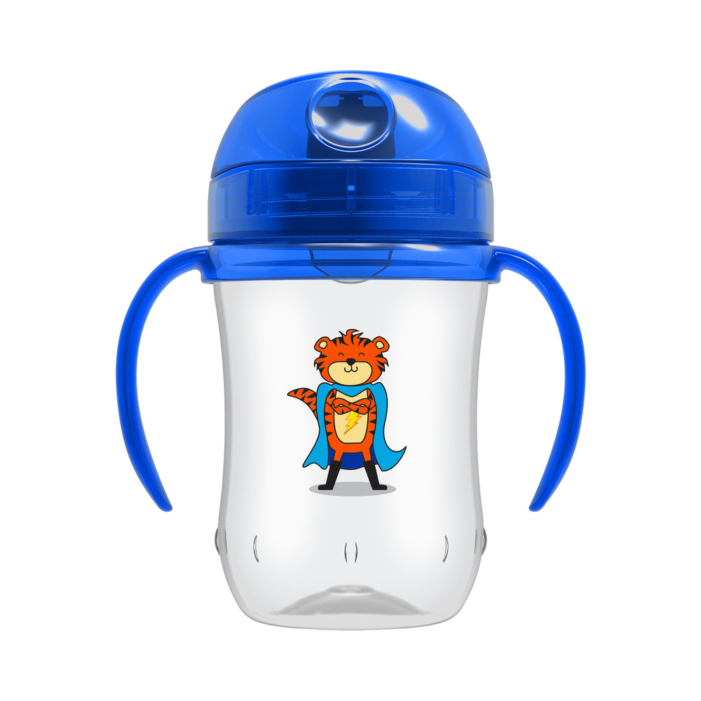 The Dr. Brown's Soft-Spout Toddler Cup, designed for bottle-to-cup transitions, is clear with blue handles and a lid. It features an orange cartoon tiger dressed as a superhero with a blue cape and has a silicone spout that ensures spill-free learning. Suitable for children 9 months and older, this cup holds 9 oz/270 ml.