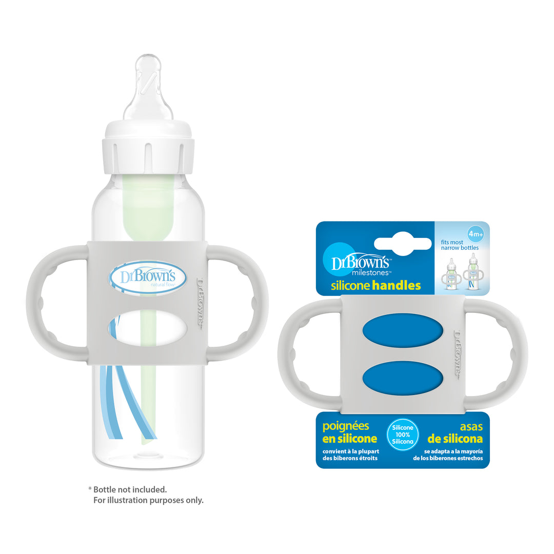 Dr. Brown's® Milestones™ Narrow Silicone Handles facilitate the development of independent drinking skills. The image shows a clear baby bottle equipped with these silicone handles alongside its packaging, emphasizing its compatibility with Dr. Brown’s Narrow Bottles for a safe and easy grip.