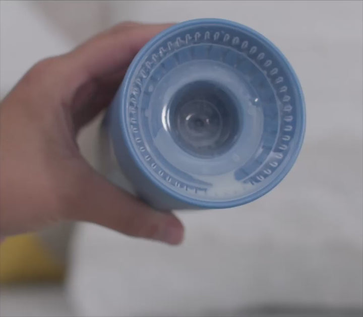 Pouring milk into the spout of a Dr. Brown's Cheers360 cup