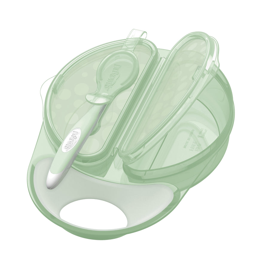 Introducing the Dr. Brown's Travel Fresh Bowl & Spoon Combo in Light Green, a travel feeding bowl set that includes a spoon and lid. This set boasts separate compartments for simple portioning and is adorned with a charming polka dot pattern on the lid, making it ideal for easy food transportation.