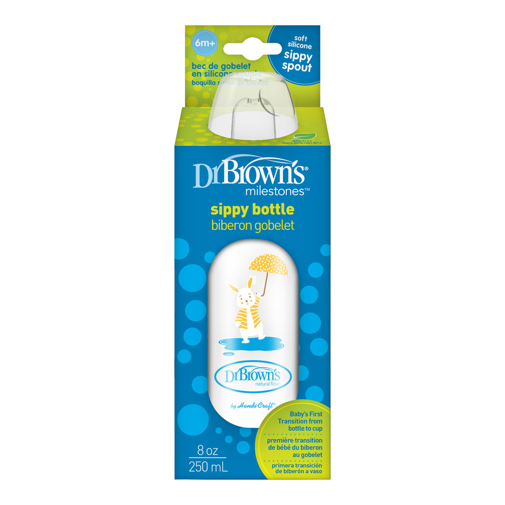 Image of Dr. Brown's® Milestones™ Narrow Sippy Bottle, 8oz/250mL, 6m+ in packaging. The bottle features a soft silicone sippy spout, perfect for transitioning from bottle to cup, is appropriate for babies aged 6 months and older, and showcases a giraffe illustration with a yellow umbrella on the design.