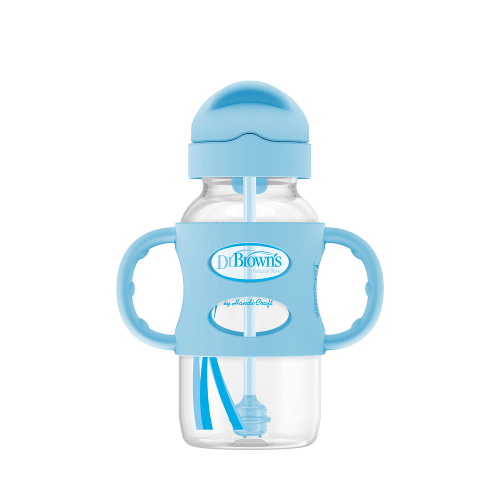 The Dr. Brown’s™ Milestones™ Wide-Neck Sippy Straw Bottle, 9 oz/270 mL, includes a blue lid, silicone weighted straw, and dual side silicone handles that encourage independent drinking skills. Proudly branded with "Dr. Brown's," the bottle features a transparent design.