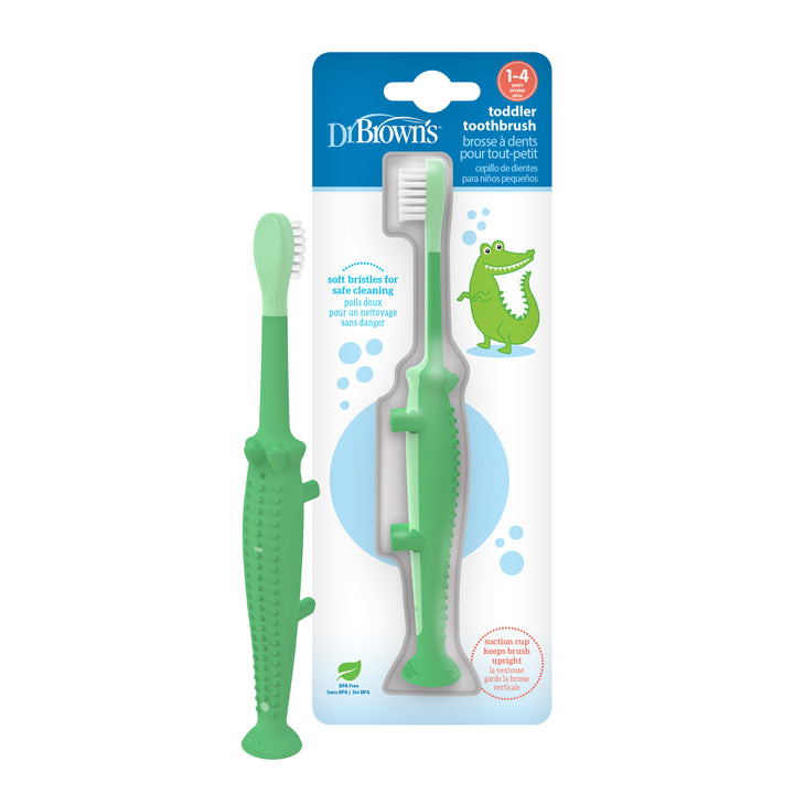 The Dr. Brown’s™ Crocodile Toddler Toothbrush, featuring super-soft bristles and a suction-cup base, is designed to resemble a friendly green crocodile. Its packaging, decorated with a cartoon crocodile, makes it clear that it's ideal for children aged 1-4.