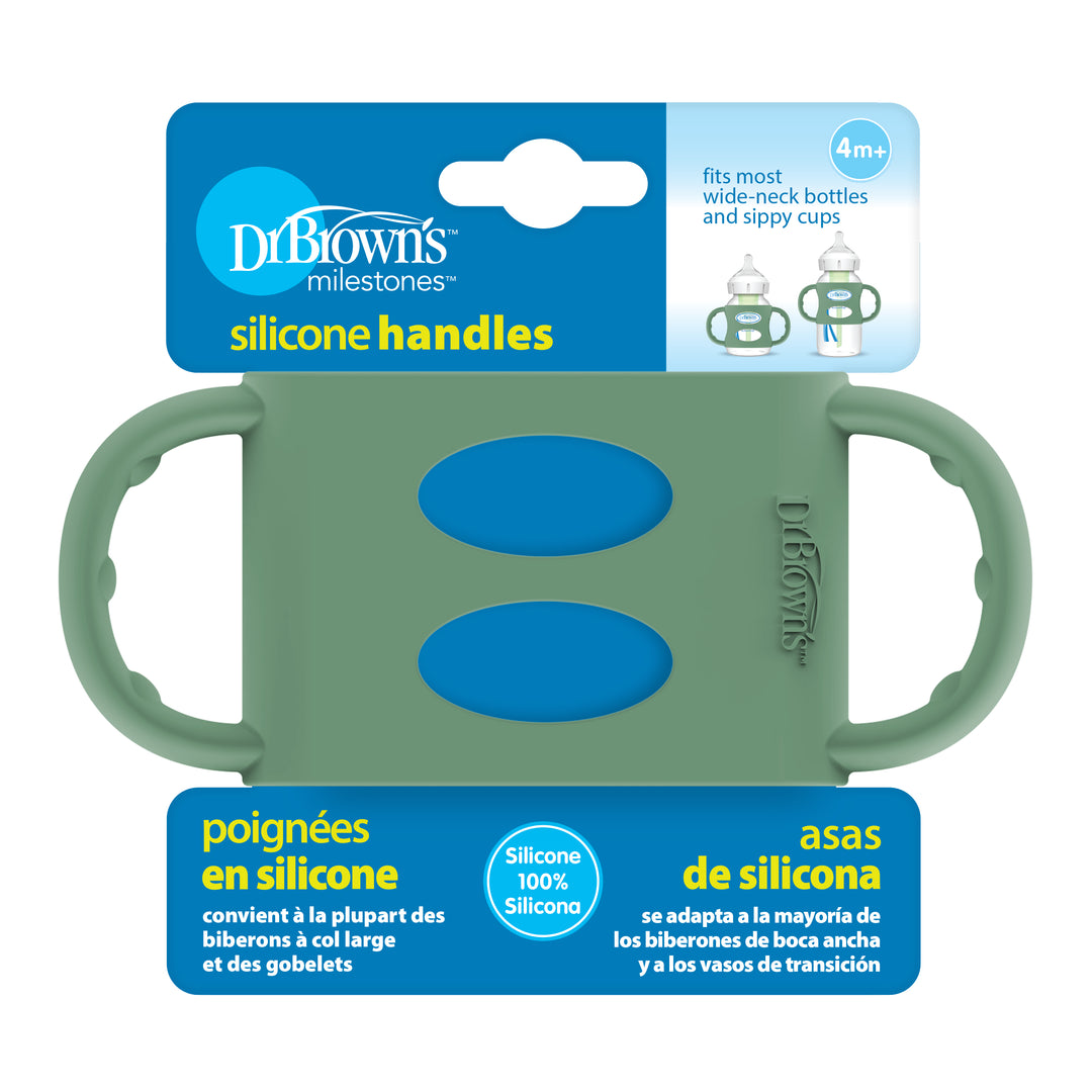 Introducing the packaging for Dr. Brown’s® Milestones™ Wide-Neck Silicone Handles by Dr. Brown's, carefully designed to foster independent drinking skills. Suitable for most wide-neck bottles and sippy cups for children aged 4 months and older, this package features a no-slip easy-grip green handle with blue accents and includes text in English, French, and Spanish.