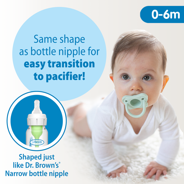 A baby with a Dr. Brown’s® Lovey Pacifier and Teether Holder, Giraffe, lies on a white surface. Text highlights that the pacifier has the same shape as Dr. Brown's Narrow bottle nipple, facilitating an easy transition. An inset shows the bottle alongside a blue background with "0-6m".