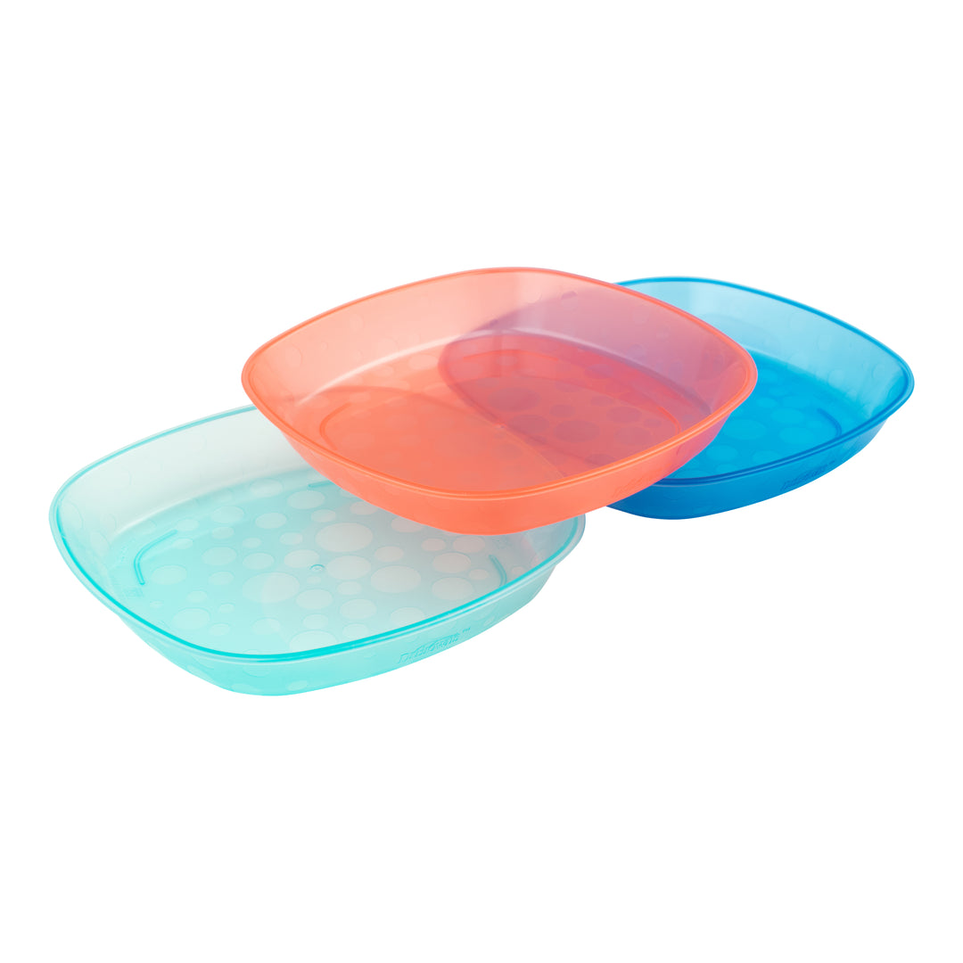 A set of three Dr. Brown's Toddler Plates, each featuring a playful polka dot pattern, is stacked slightly askew on a plain white background. The vibrant translucent square plates come in orange, blue, and teal, making them ideal for serving first foods to little ones.