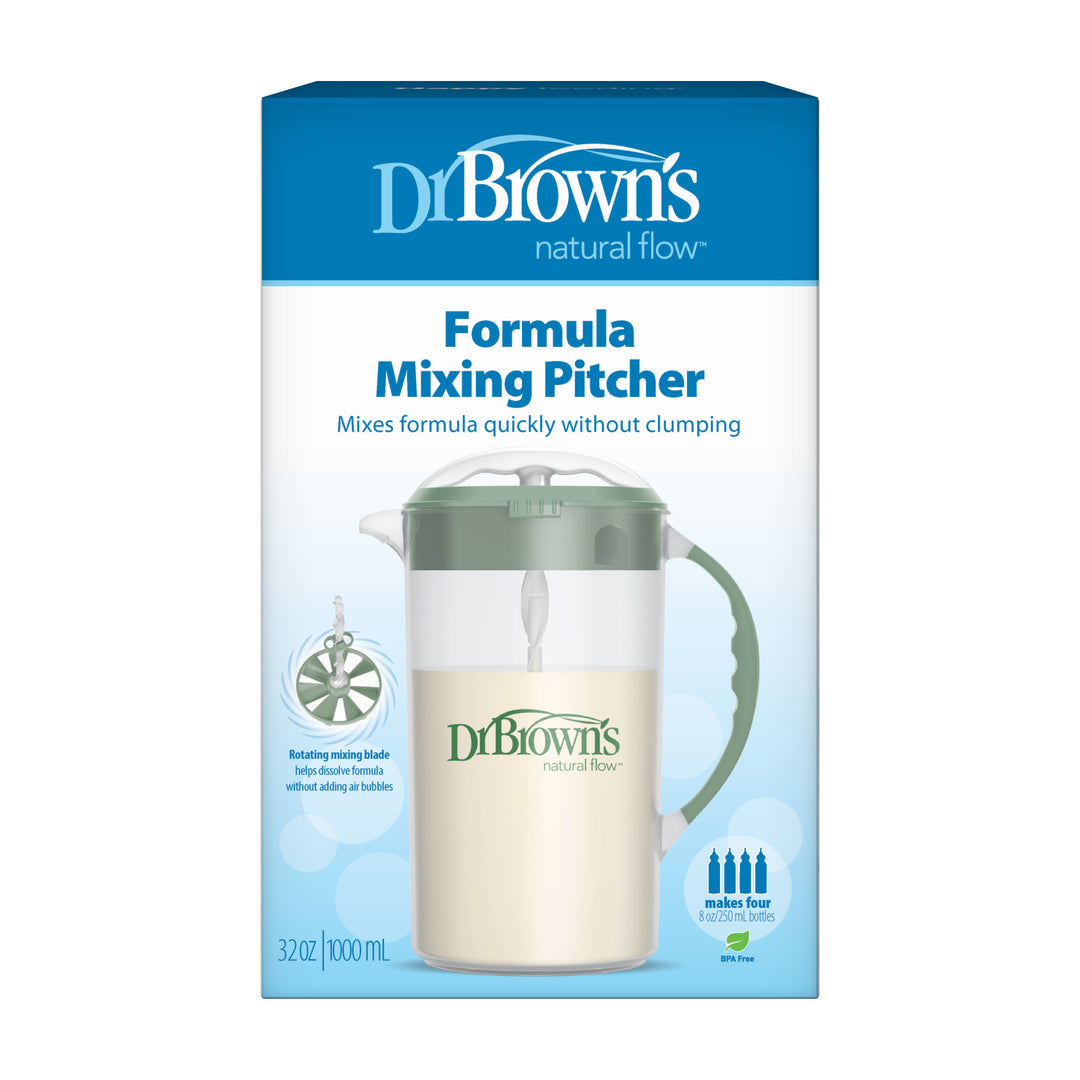 Dr. Brown's Natural Flow® Formula Mixing Pitcher is presented in a box that highlights its design for effortless formula preparation. The package emphasizes features such as "mixes formula quickly without clumping" and includes an image of the pitcher with its distinctive green handle and mixing blade, making it perfect for efficiently filling baby bottles.