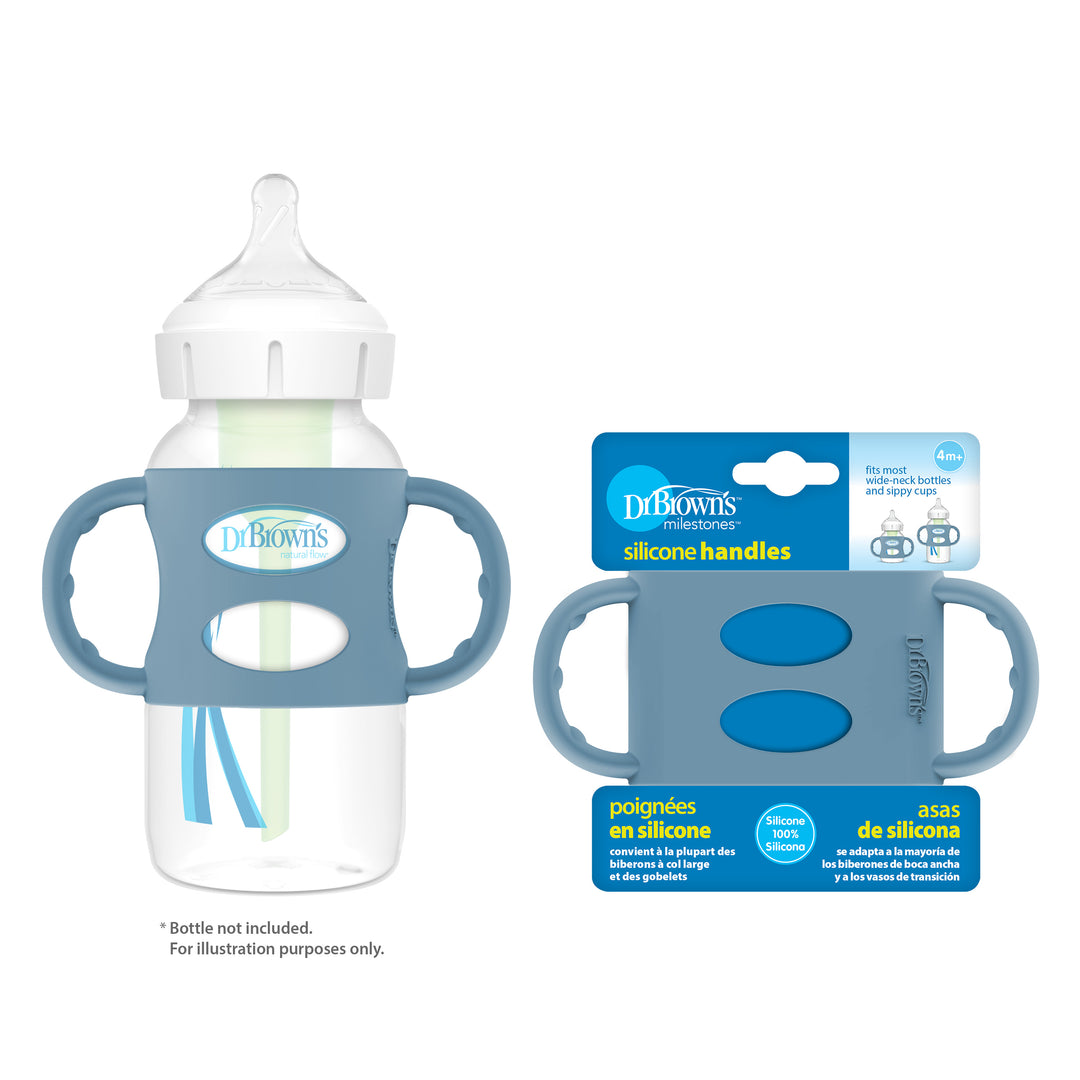 A baby bottle with a transparent body and wide-neck design is equipped with two blue silicone handles. Next to it is the packaging for Dr. Brown’s® Milestones™ Wide-Neck Silicone Handles from Dr. Brown's, which aids in developing independent drinking skills and highlights that the bottle is not included. The packaging features vibrant blue and white colors.