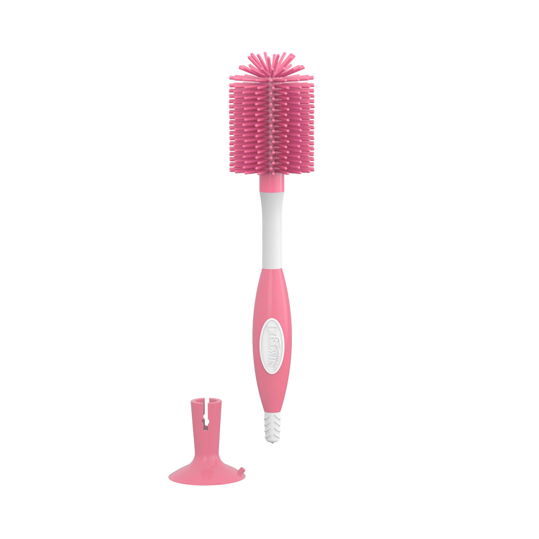 Dr. Brown’s™ Soft Touch Bottle Brush by Dr. Brown's offers a durable design in pink silicone with a white and pink handle and soft bristles for scratch-free cleaning, along with a detachable base for convenient storage.