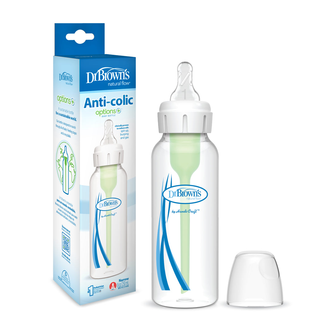 Picture of a Dr. Brown’s Natural Flow® Anti-Colic Options+™ Narrow Baby Bottle featuring a Level 1 Slow Flow Nipple. The clear bottle displays a green vent within, placed alongside its packaging that emphasizes the anti-colic benefits and the Dr. Brown's logo. A white cap is neatly positioned next to the bottle.