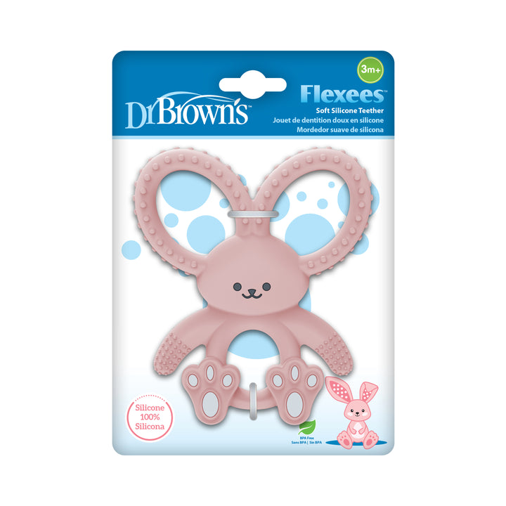 A Dr. Brown's™ Flexees™ Bunny Teether from the brand Dr. Brown's is shown in its packaging. This pink silicone teether, designed like a rabbit, features textured ears and feet for effective relief and is suitable for babies aged 3 months and older.