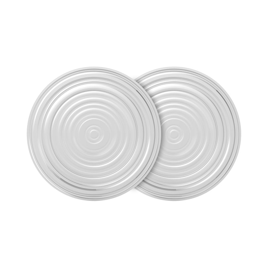 An overhead view of two silver tin can lids overlapping evokes the design of Dr. Brown's Membrane for Electric Breast Pumps. The lids feature concentric circular ridges and a shiny metallic surface, reminiscent of this innovative product by Dr. Brown's.