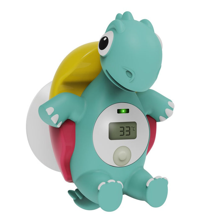 The Dr. Brown’s™ CleanUp™ Temposaurus™ Floating Bath Thermometer, a charming dinosaur-shaped device from Dr. Brown's, is perfect for monitoring water temperature. It features a digital display showing 33°C and has a teal color with big eyes, contrasting against a red background and boasting a yellow tail.