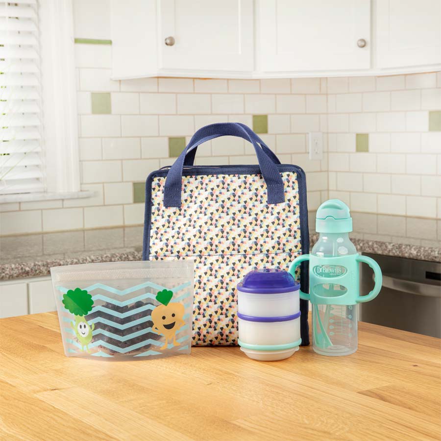 https://www.drbrownsbaby.com/wp-content/uploads/2022/05/Lifestyle_Fold_and_Freeze_Bottle_Tote_Bag_multicolor_geometric_shapes_and_Accessories.jpg