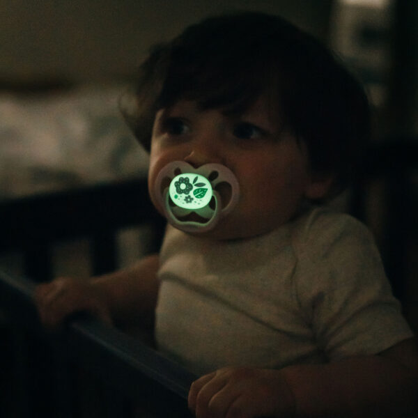 Baby with a Dr. Brown's Advantage glow-in-the-dark pacifier