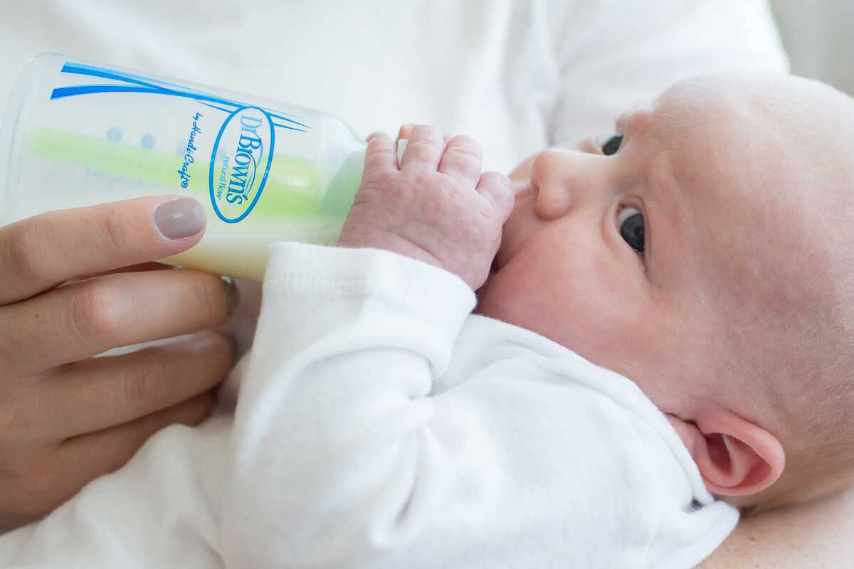 Baby feeding on a bottle